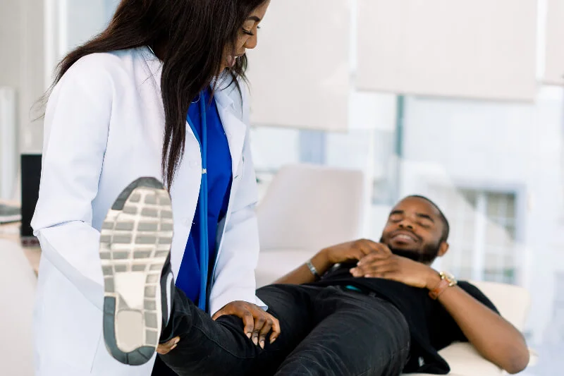 A pain management doctor treats a patient at a pain clinic in Frisco, TX