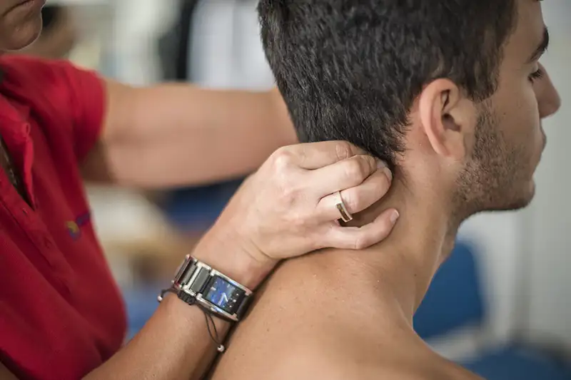 physiotherapist-visits-a-young-sportsman-who-feels