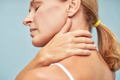 A woman with neck pain in North Dallas, TX