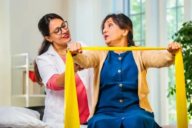 doctor-or-physiotherapist-assisting-senior-patient