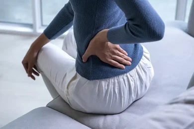 female-with-back-pain-at-home